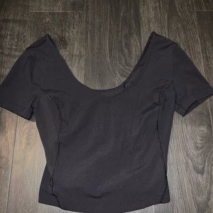 Lululemon black wide shoulder crop top. Size 4. Fits kind of tight.